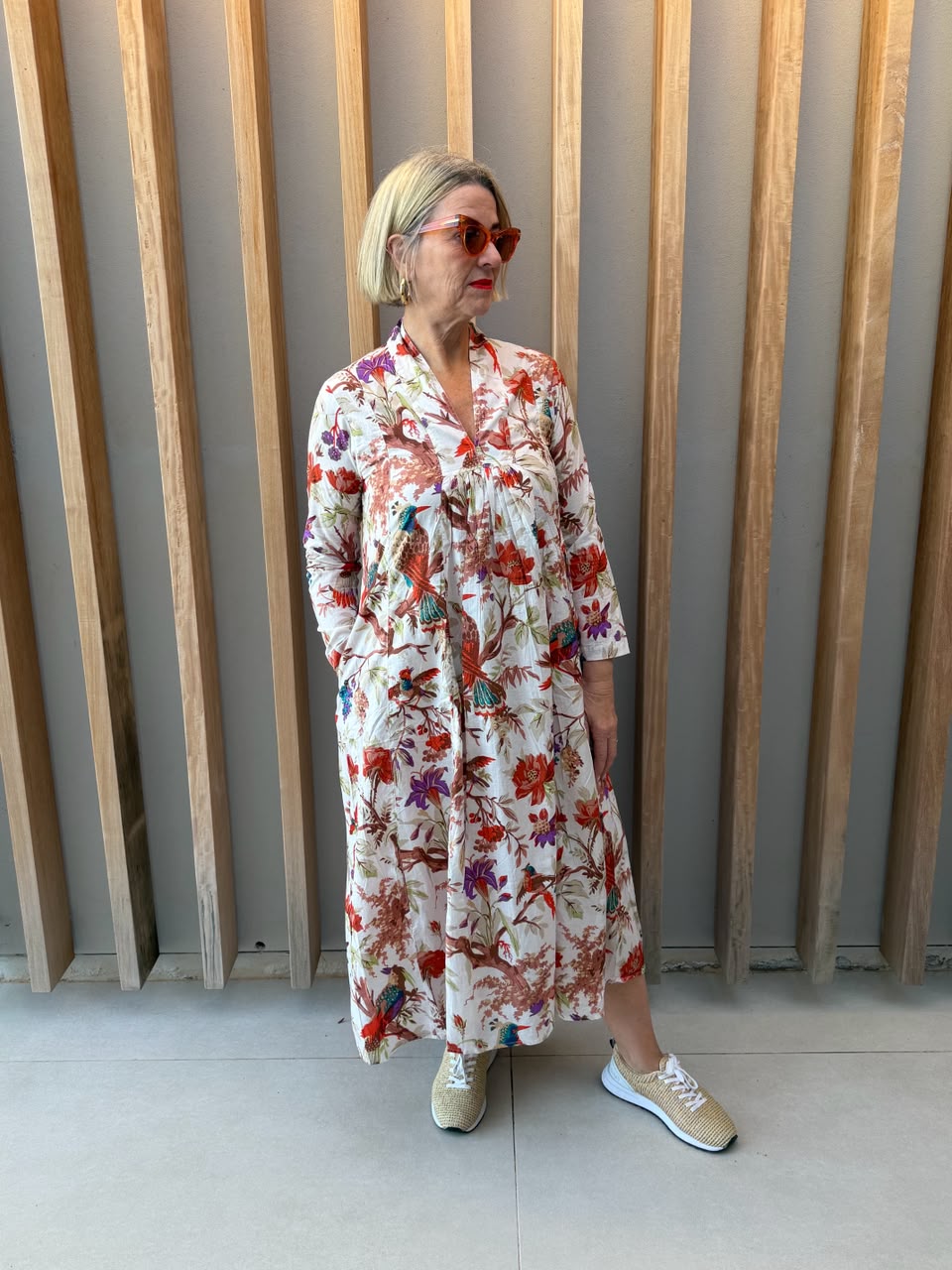 White dress with floral bird pattern