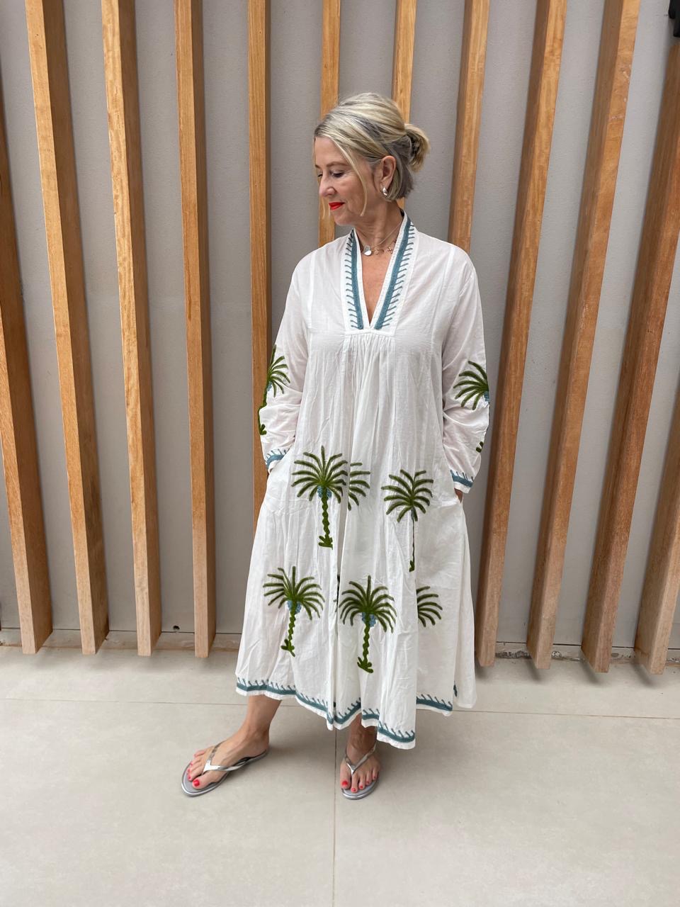 White dress with embroidered green floral palm