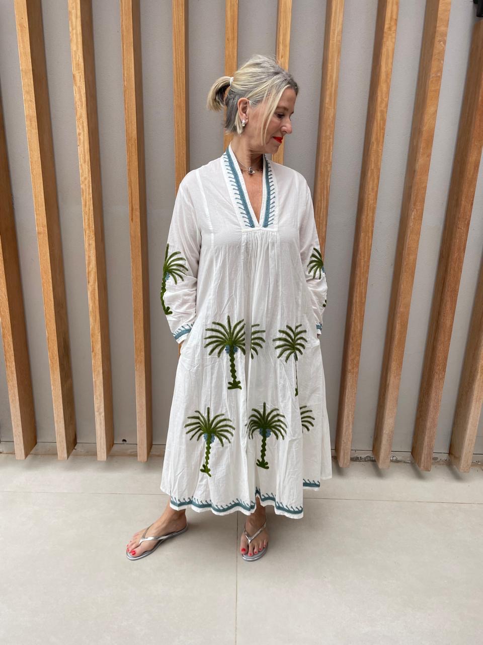 White dress with embroidered green floral palm