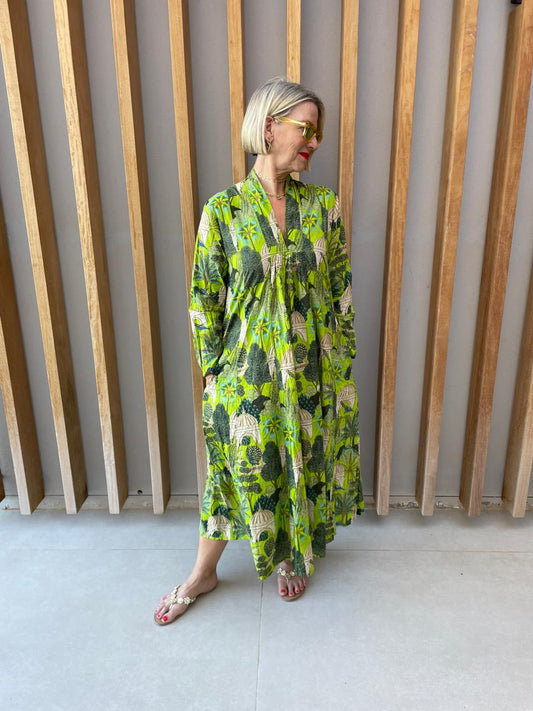 Green dress with bold forrest print