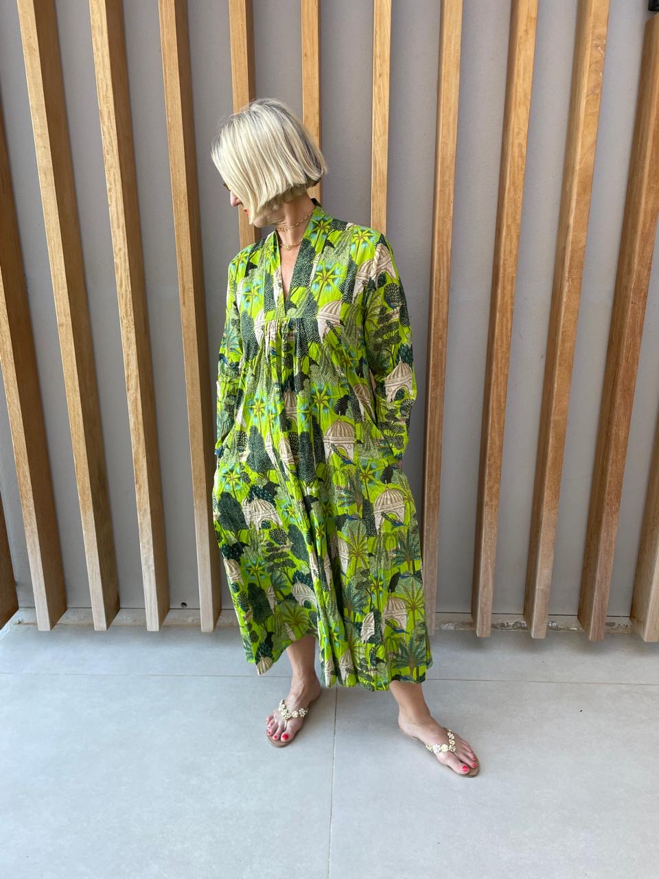 Green dress with bold forrest print