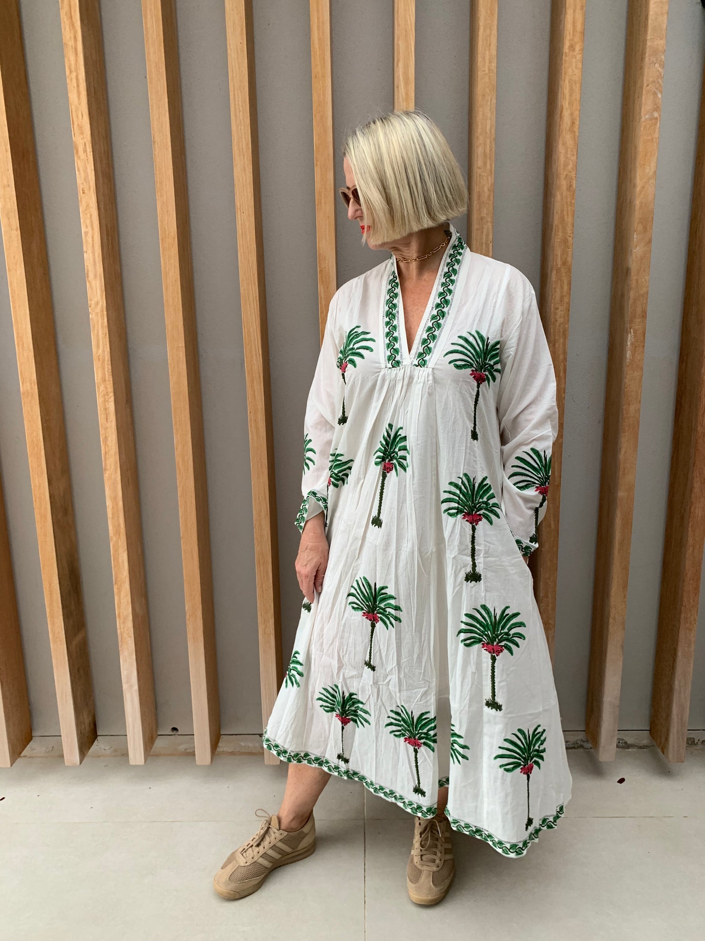 White dress with green palm pattern