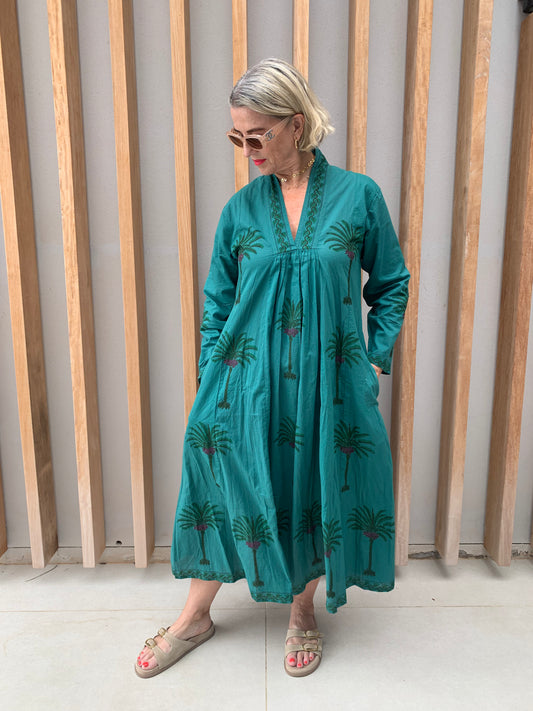 Green dress with floral palm pattern