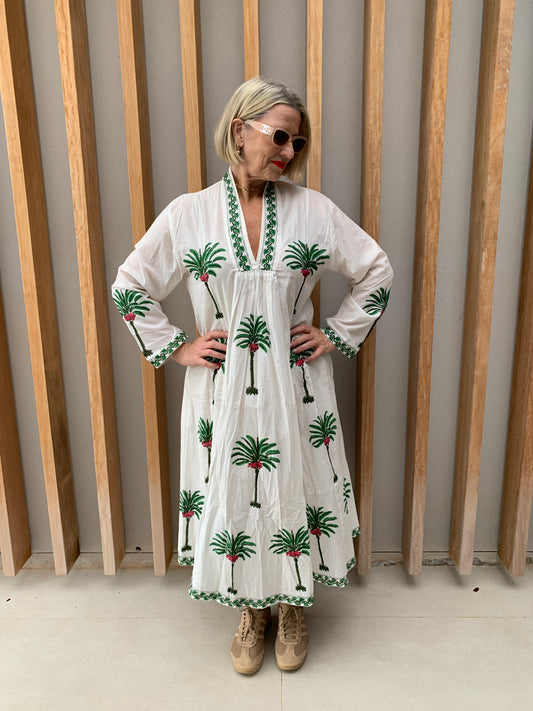 White dress with green palm pattern