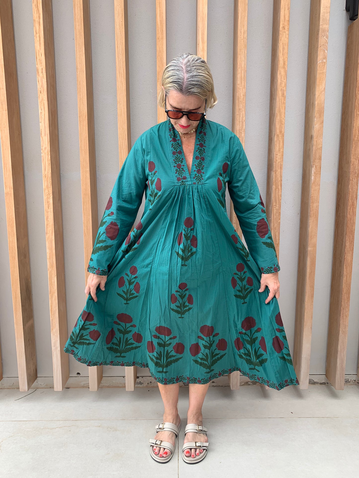 Green dress with red diasies pattern