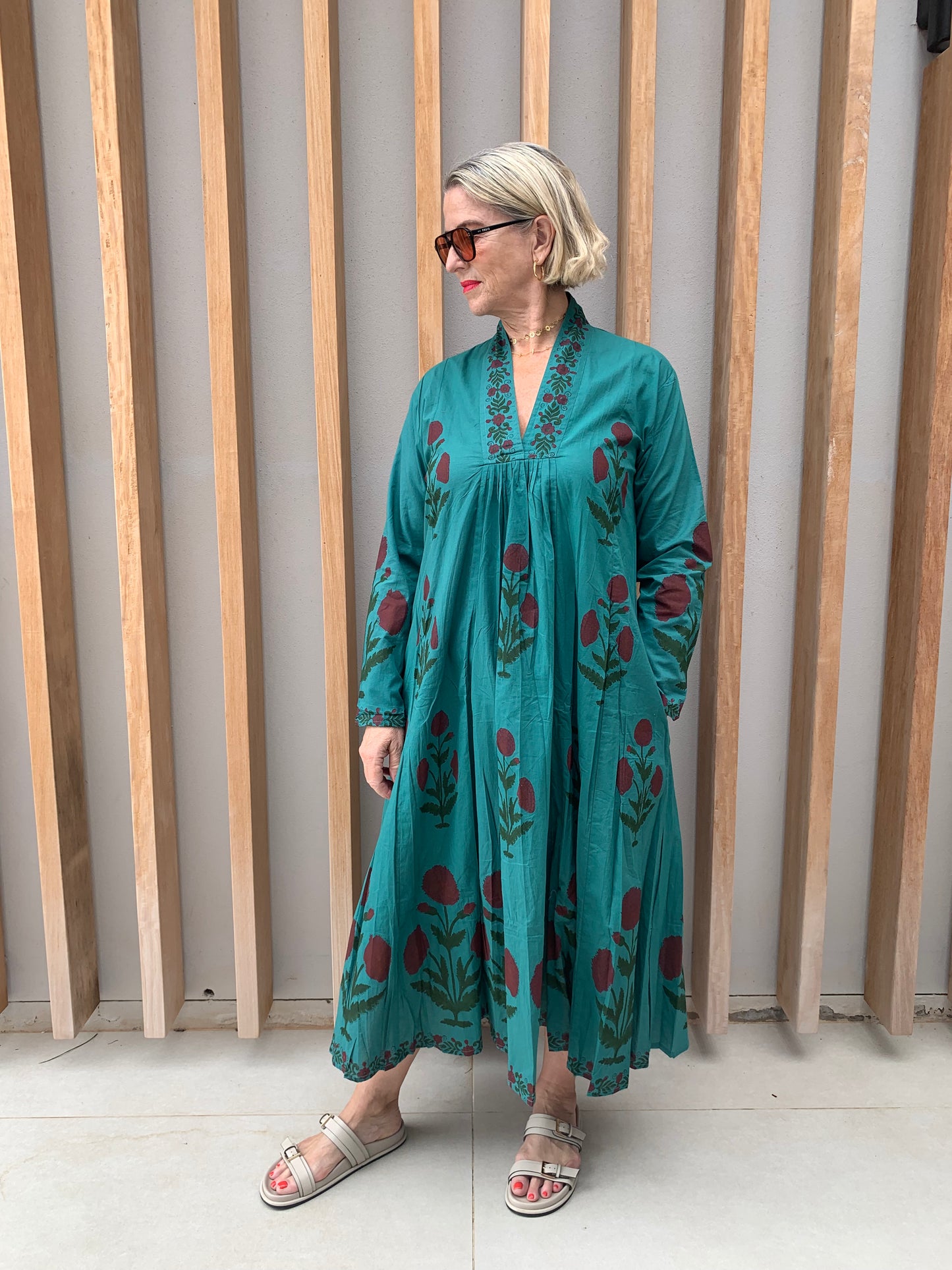 Green dress with red diasies pattern