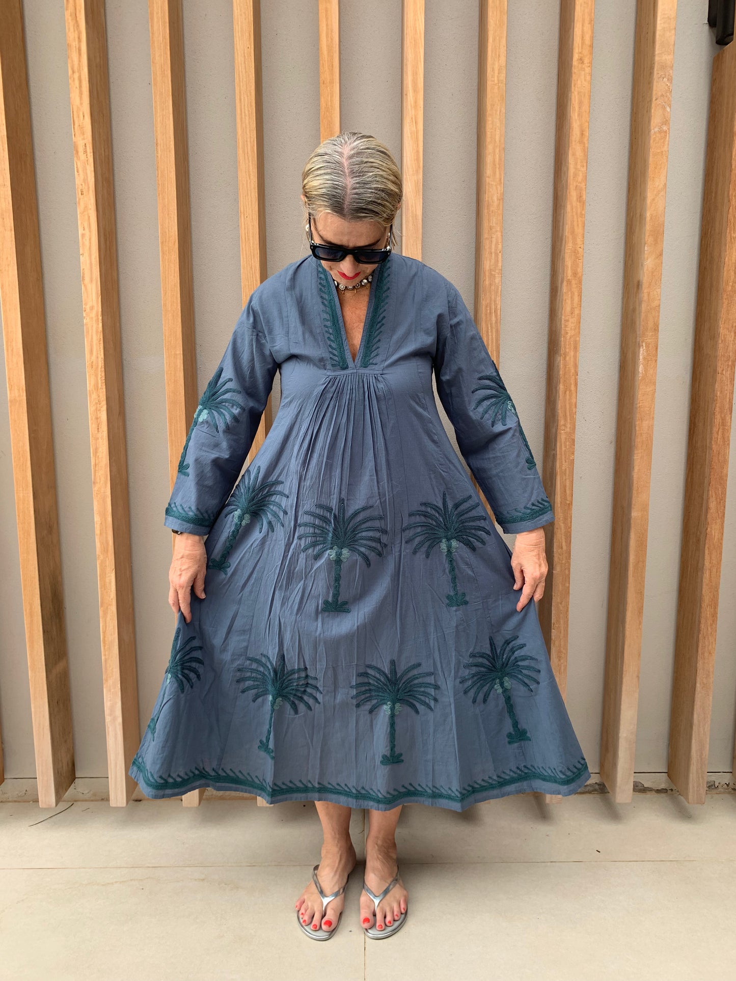Grey dress with embroidered green palm pattern