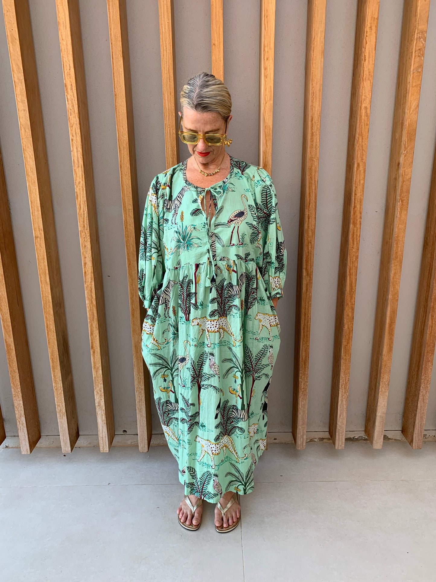 Pale green dress with jungle print pattern