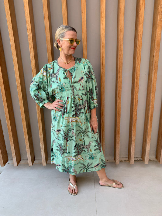 Pale green dress with jungle print pattern