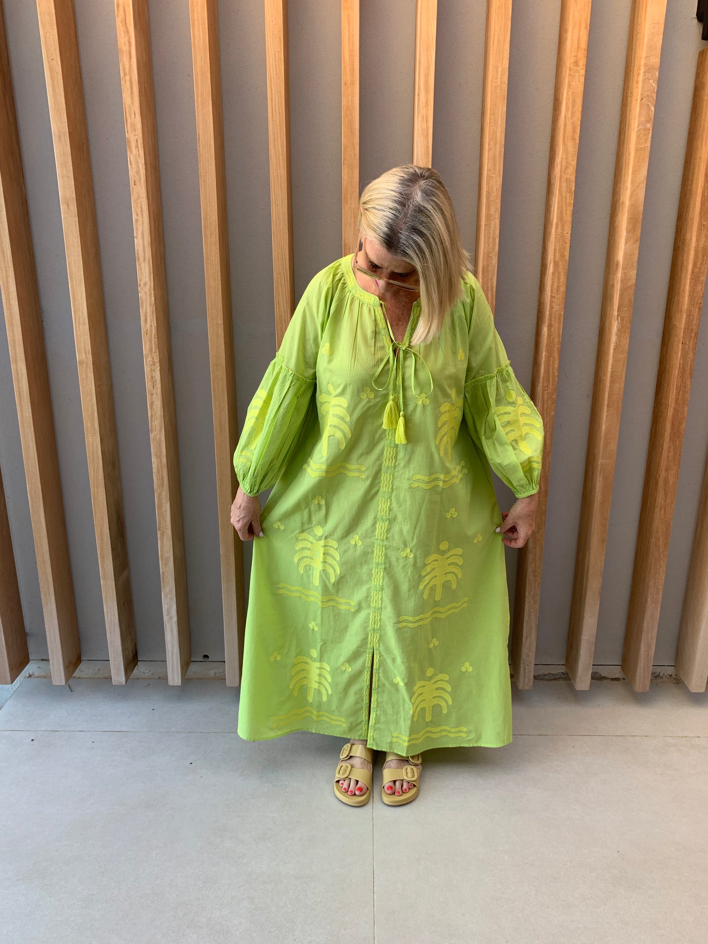 Lime green dress with embroidered palm pattern