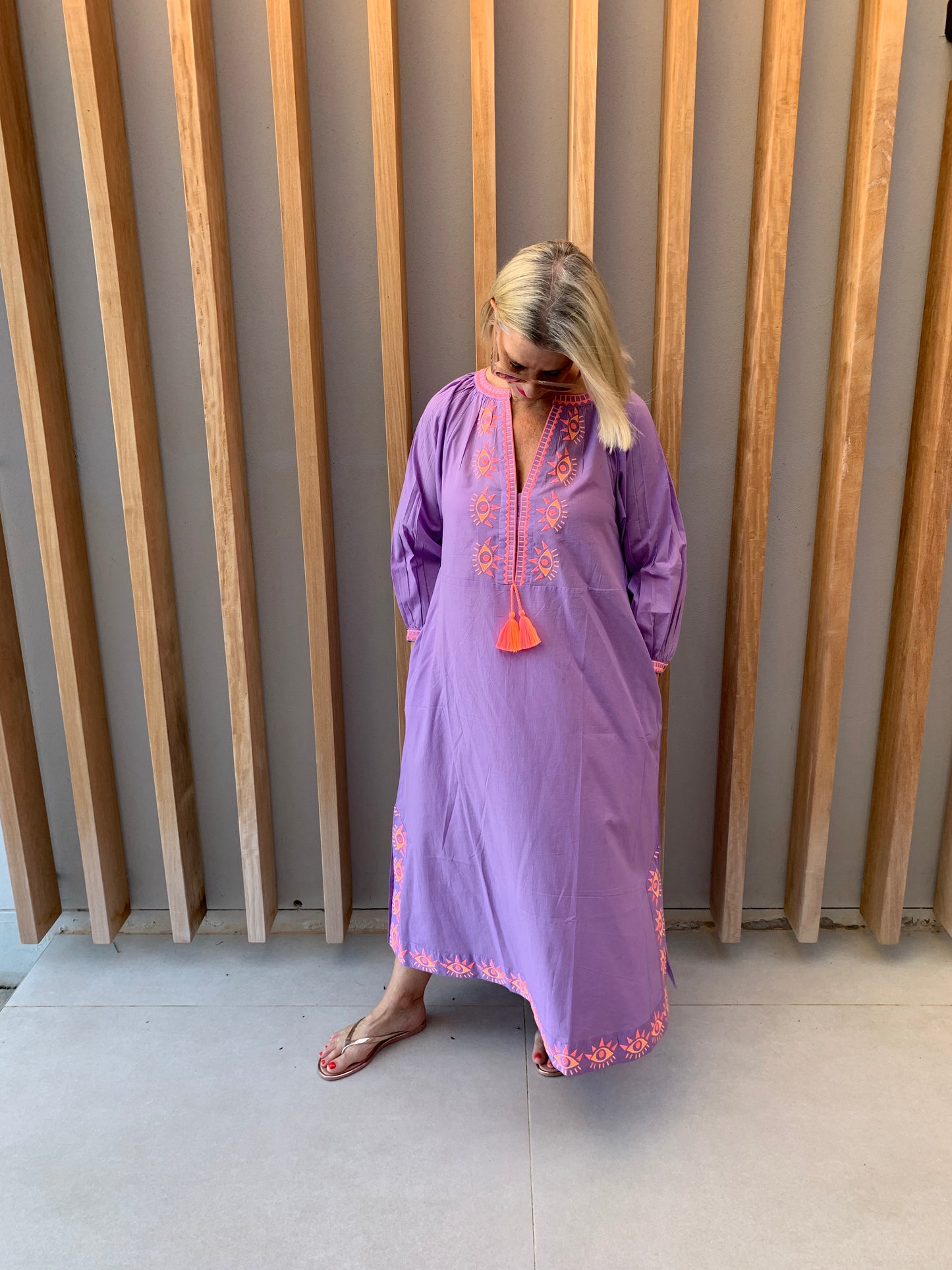 Mauve dress with embroidered orange geometric pattern