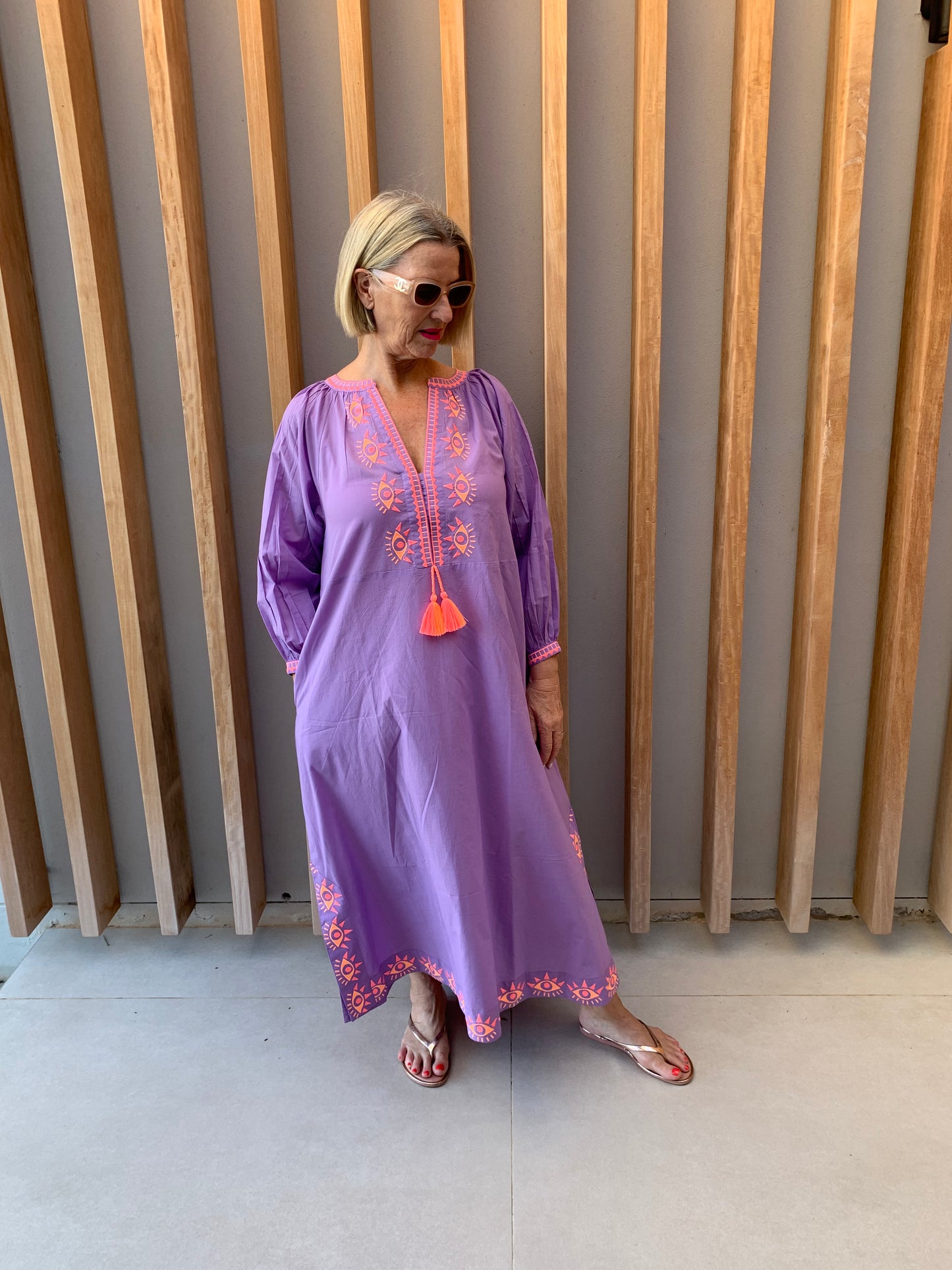 Mauve dress with embroidered orange geometric pattern