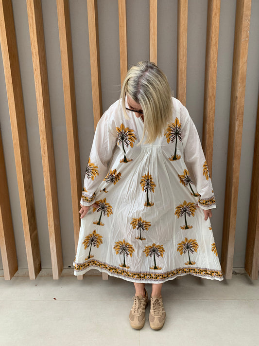 White dress with mustard palm pattern