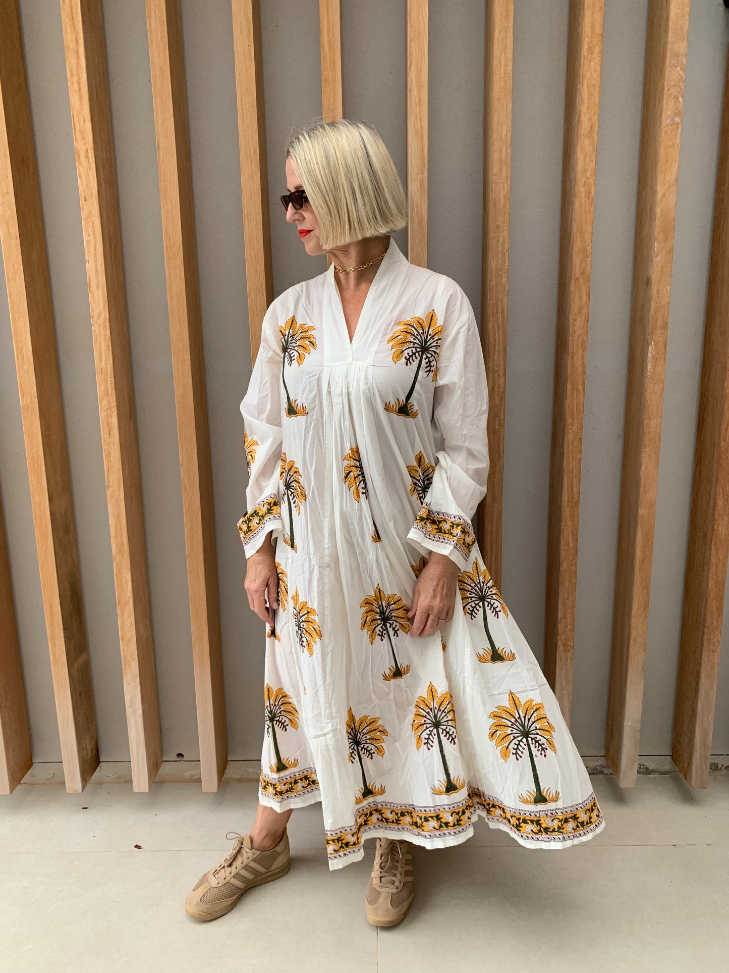 White dress with mustard palm pattern