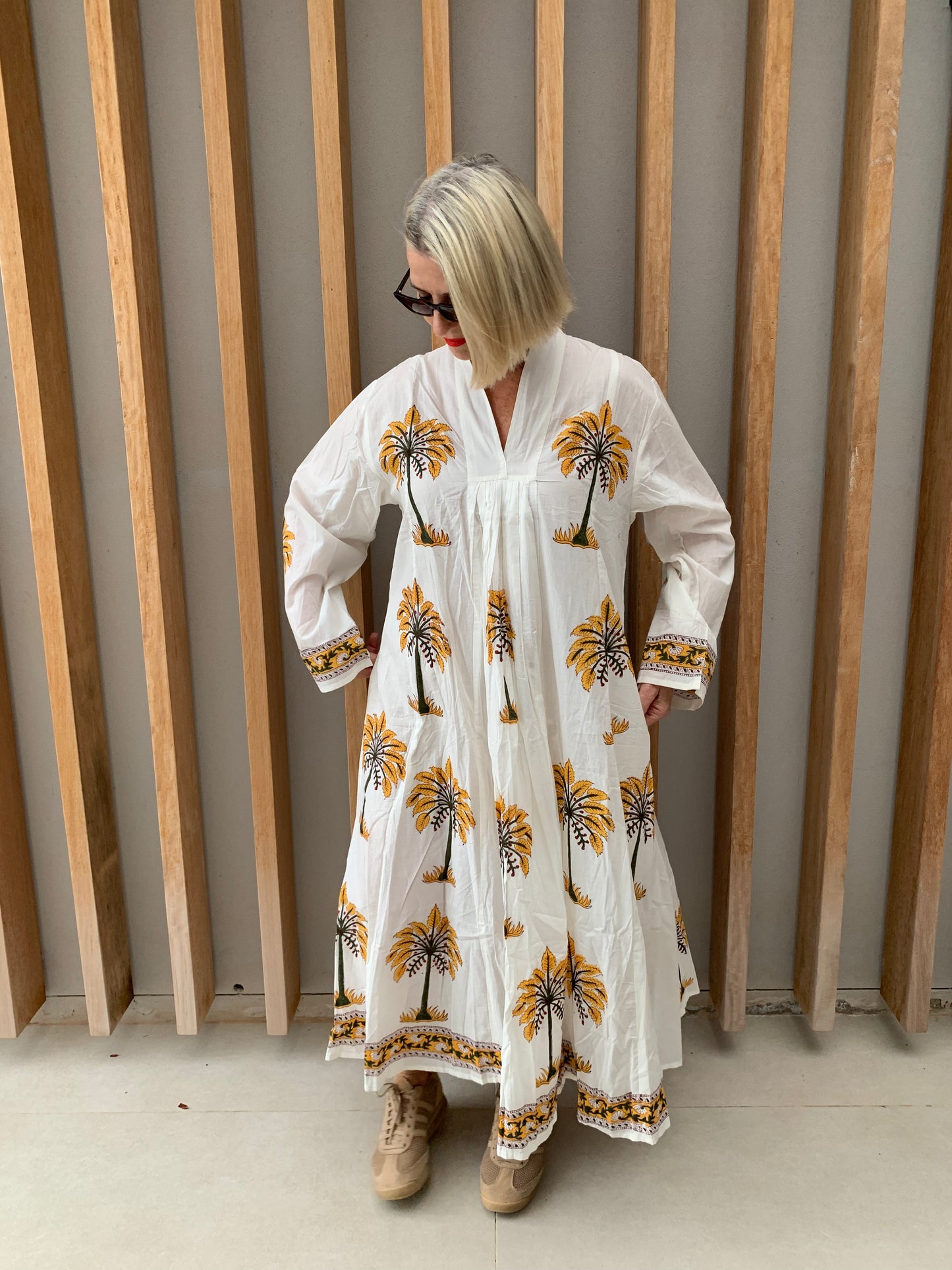 White dress with mustard palm pattern