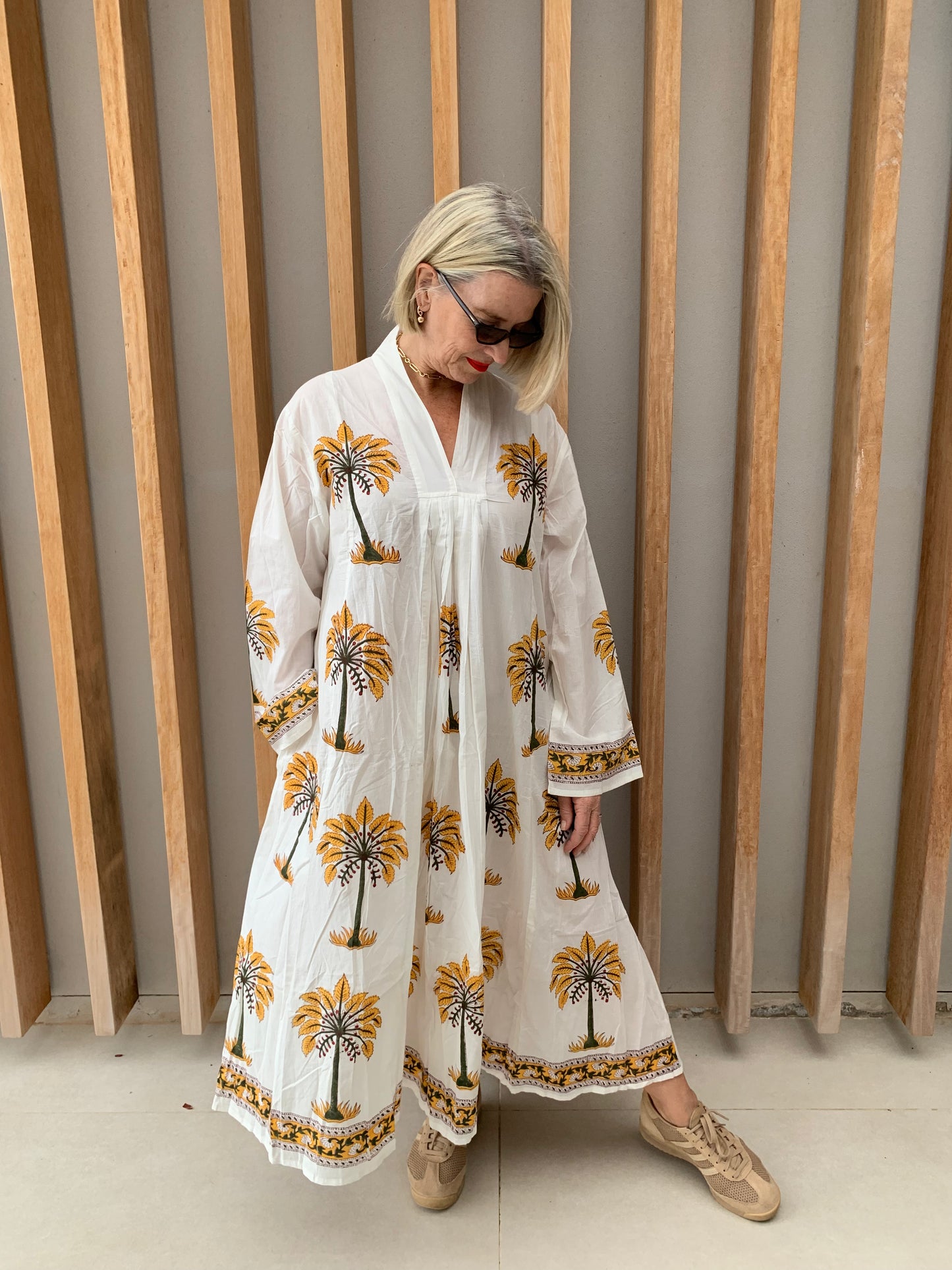 White dress with mustard palm pattern