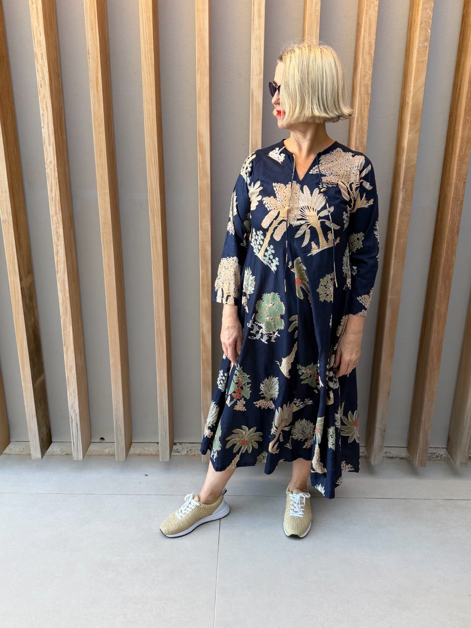 Navy dress with beige palm pattern