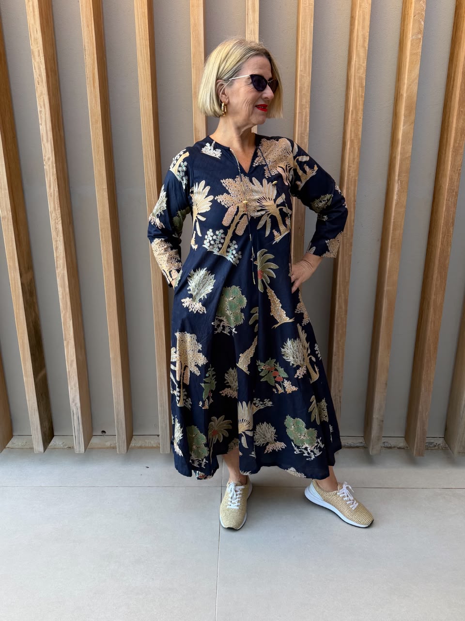 Navy dress with beige palm pattern