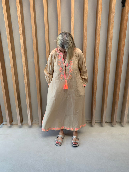 Nude colour dress with orange geometric pattern