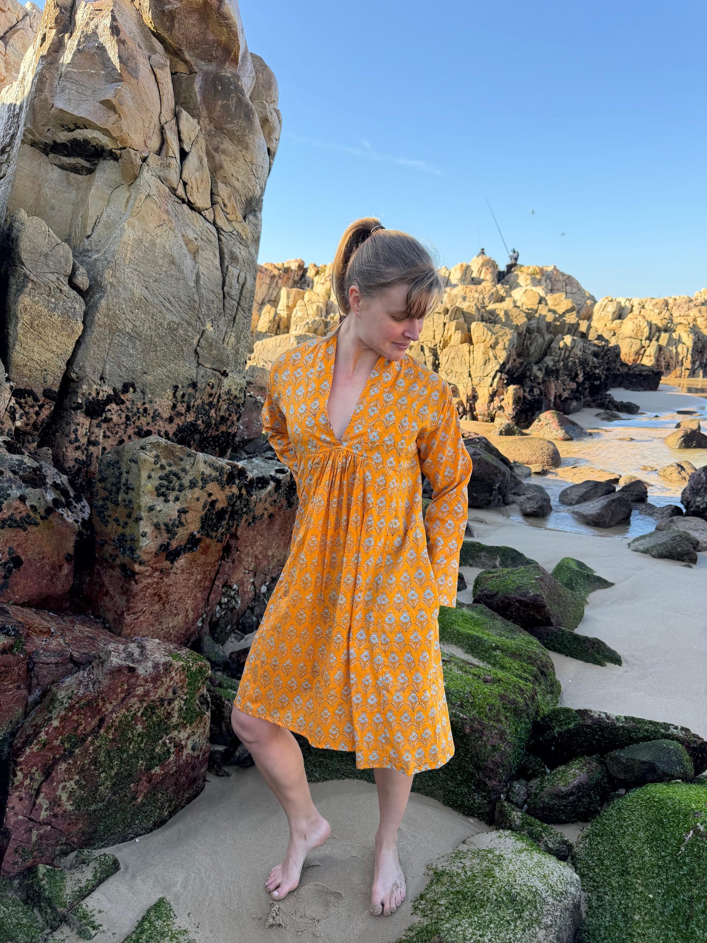 Orange dress with white floral pattern