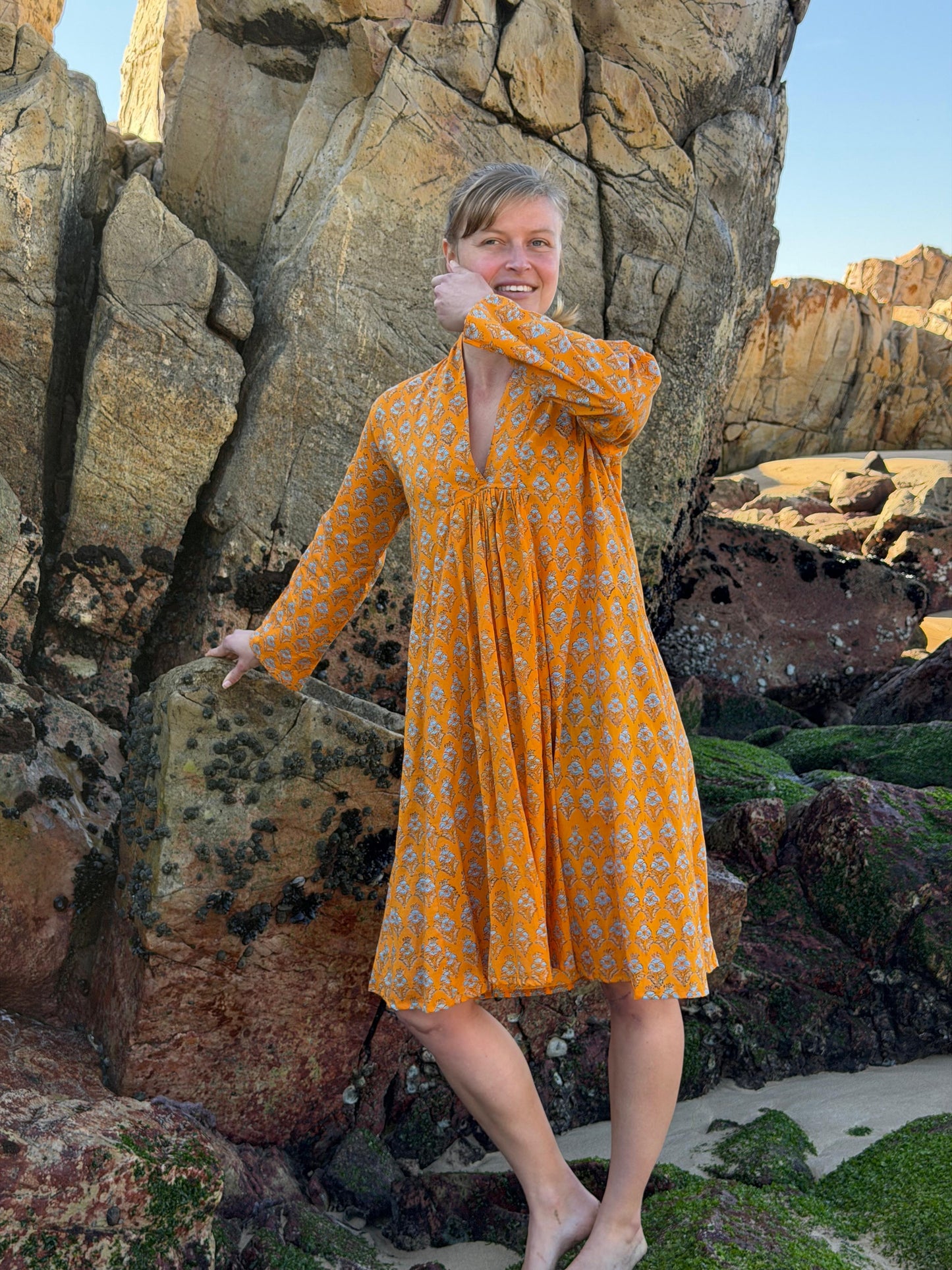 Orange dress with white floral pattern