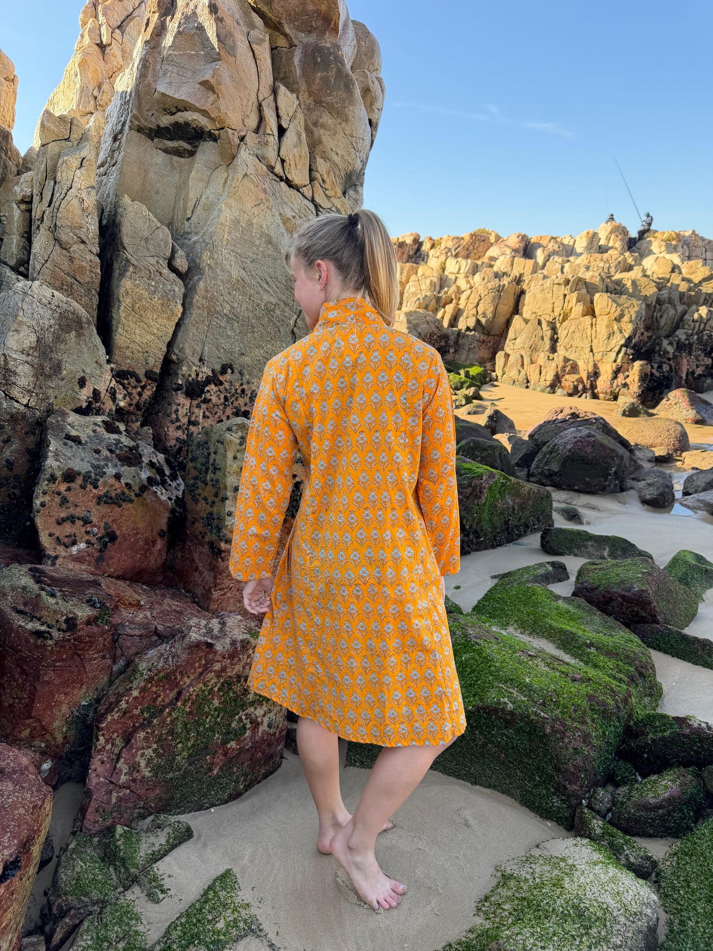 Orange dress with white floral pattern