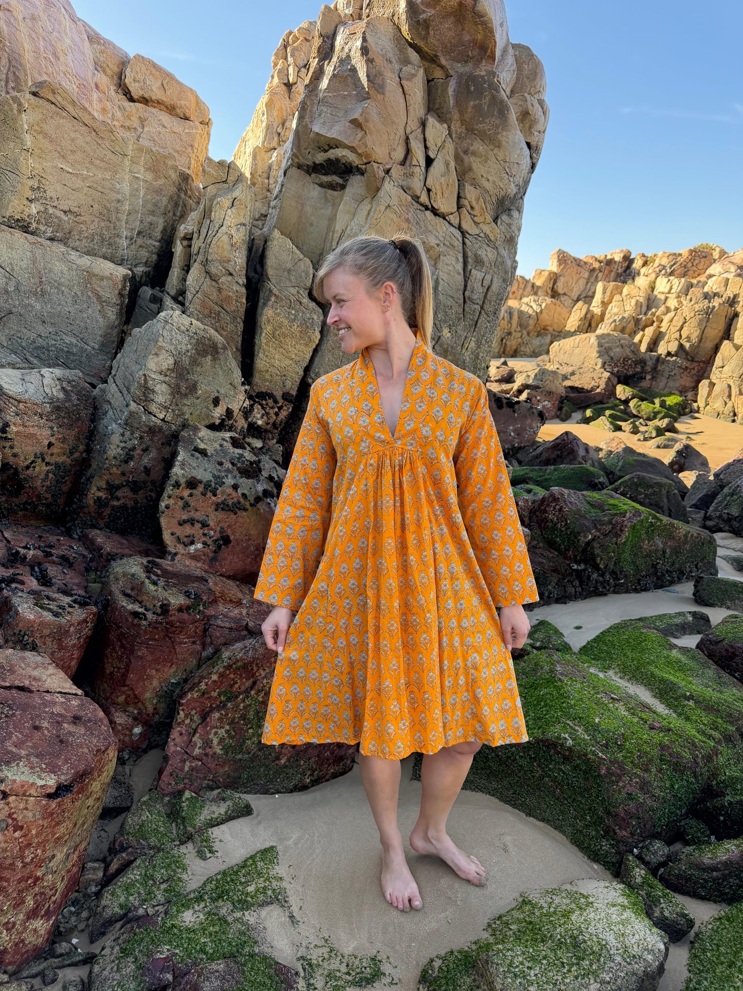Orange dress with white floral pattern