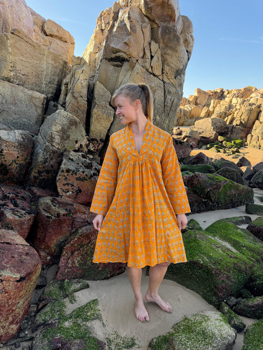 Orange dress with white floral pattern