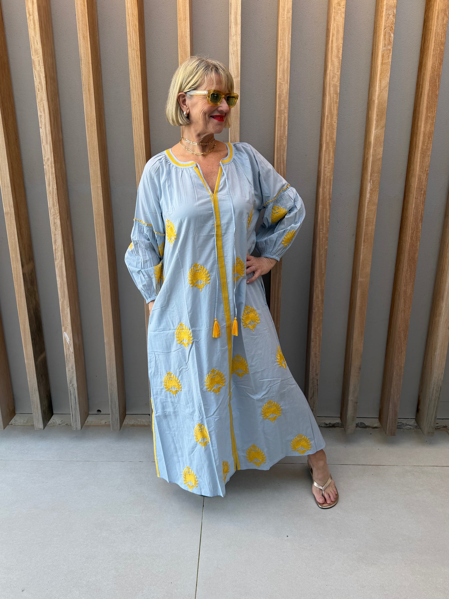 Pale blue dress with embroidered gold pattern