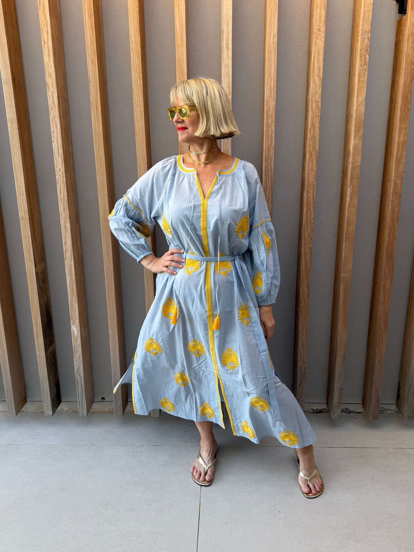 Pale blue dress with embroidered gold pattern