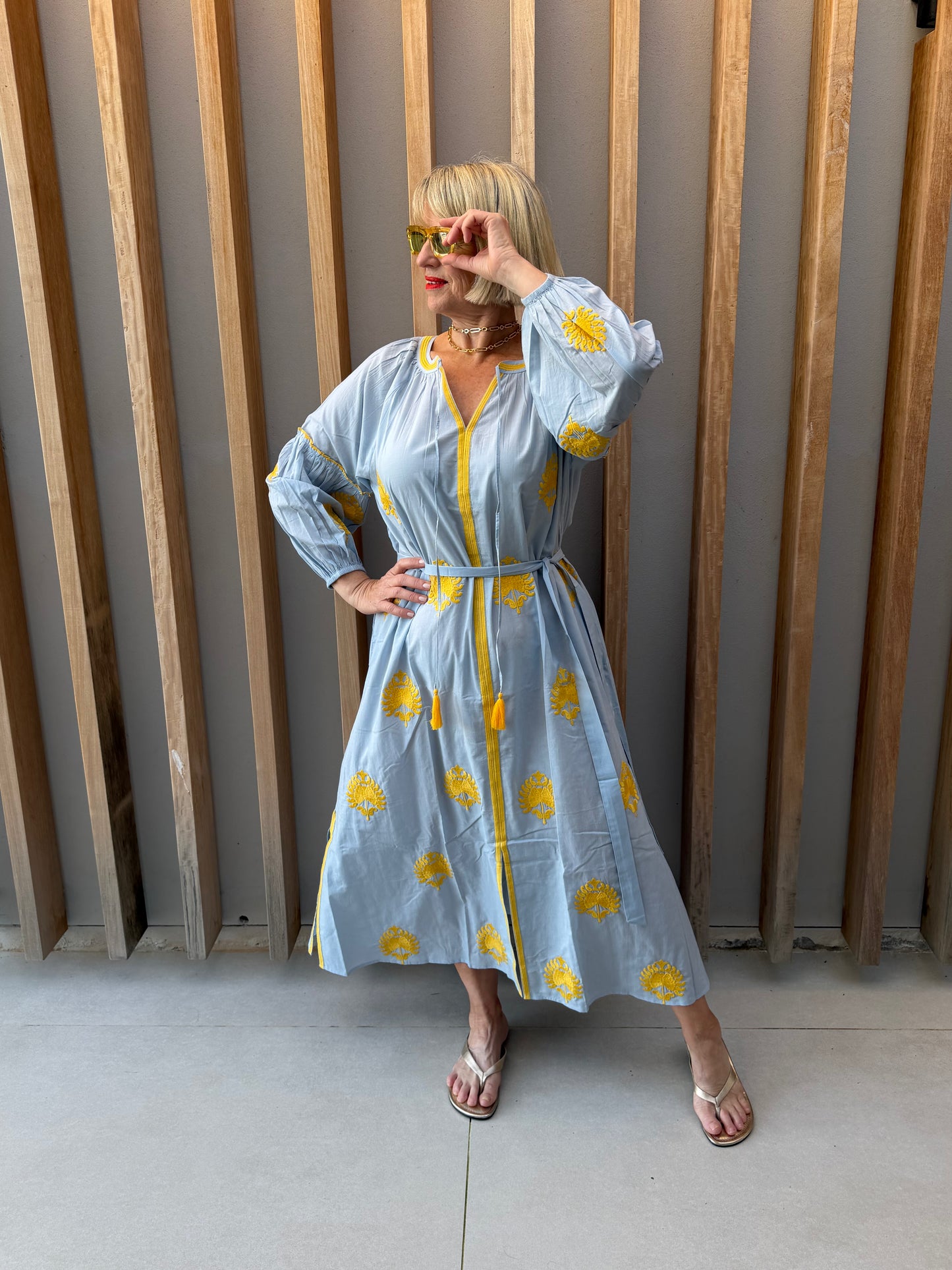 Pale blue dress with embroidered gold pattern