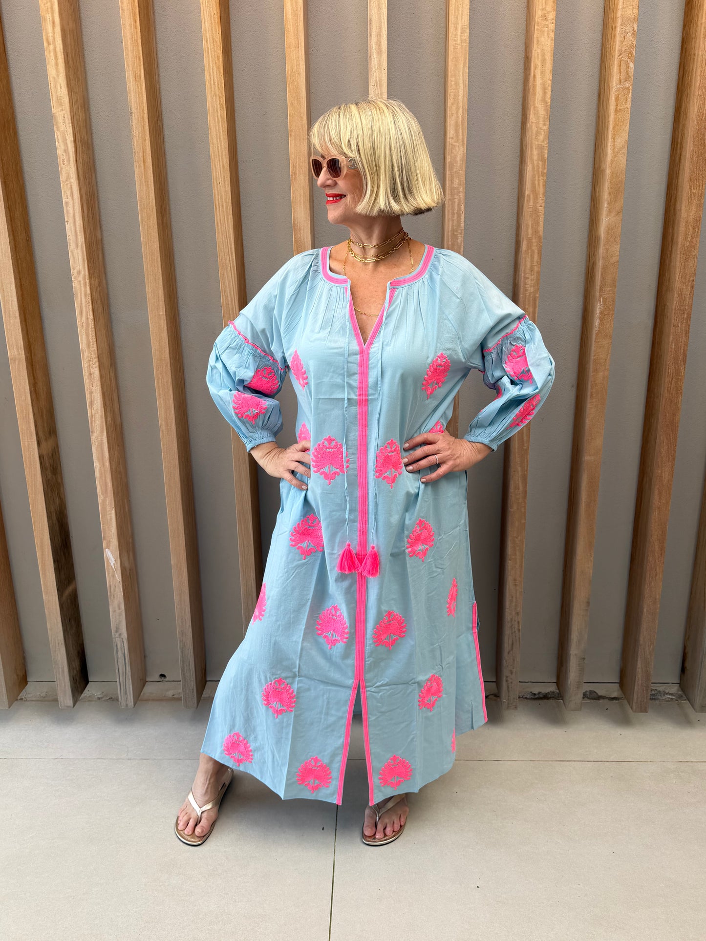 Pale blue dress with pink embroidered pattern
