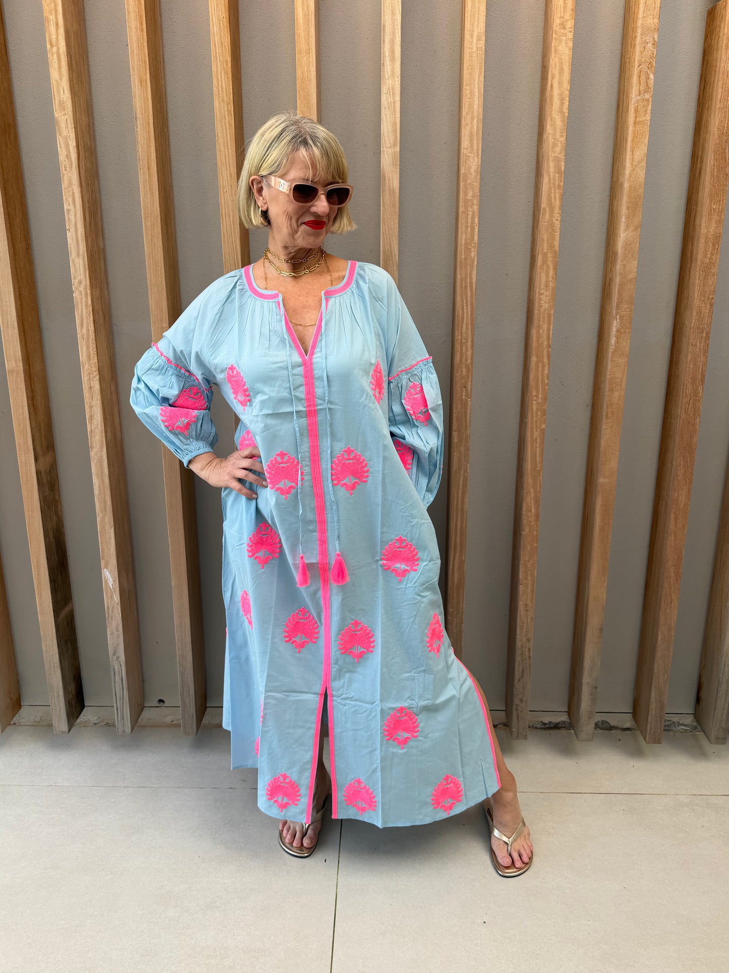 Pale blue dress with pink embroidered pattern