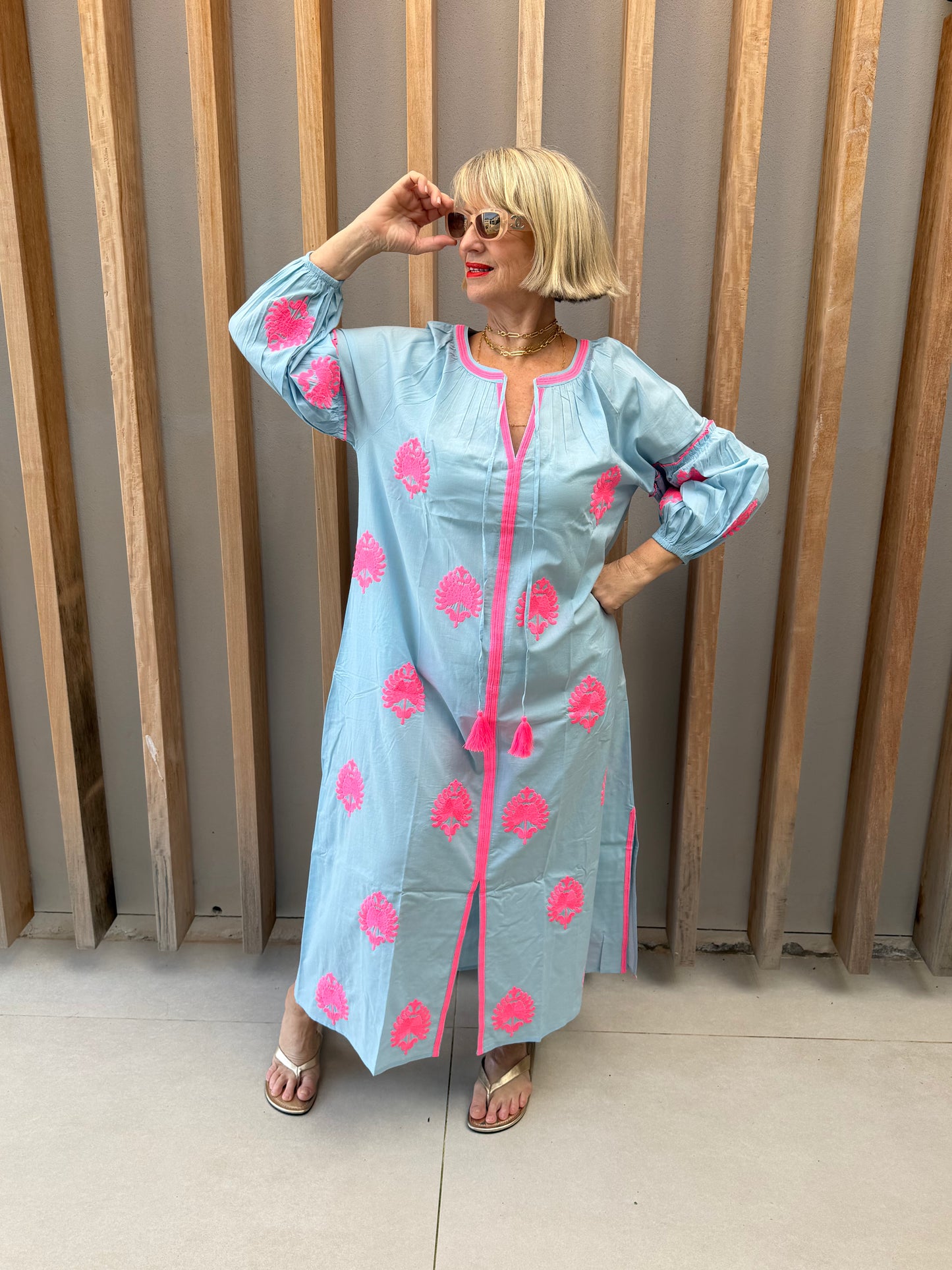 Pale blue dress with pink embroidered pattern