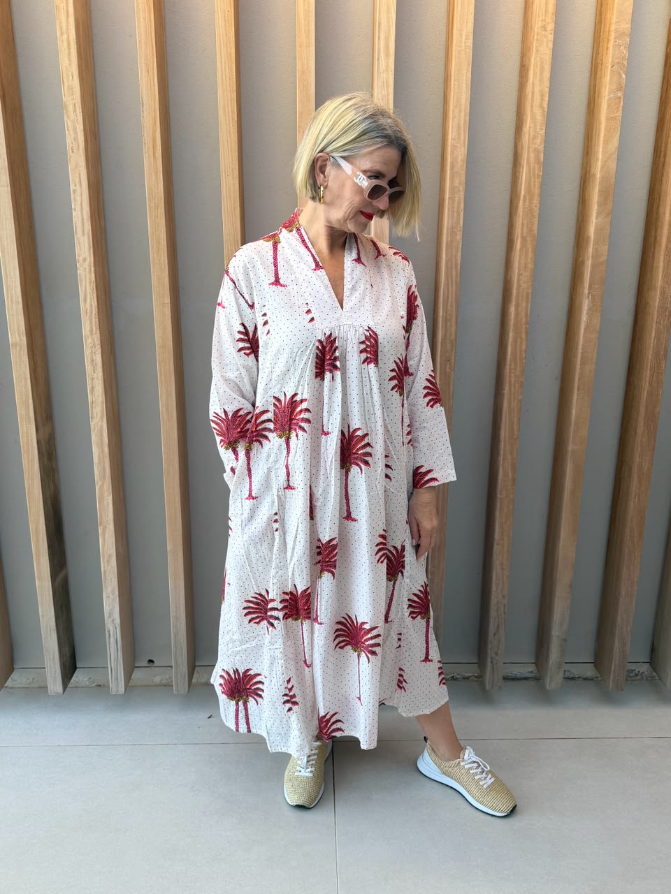 White dress with salmon pink palm pattern