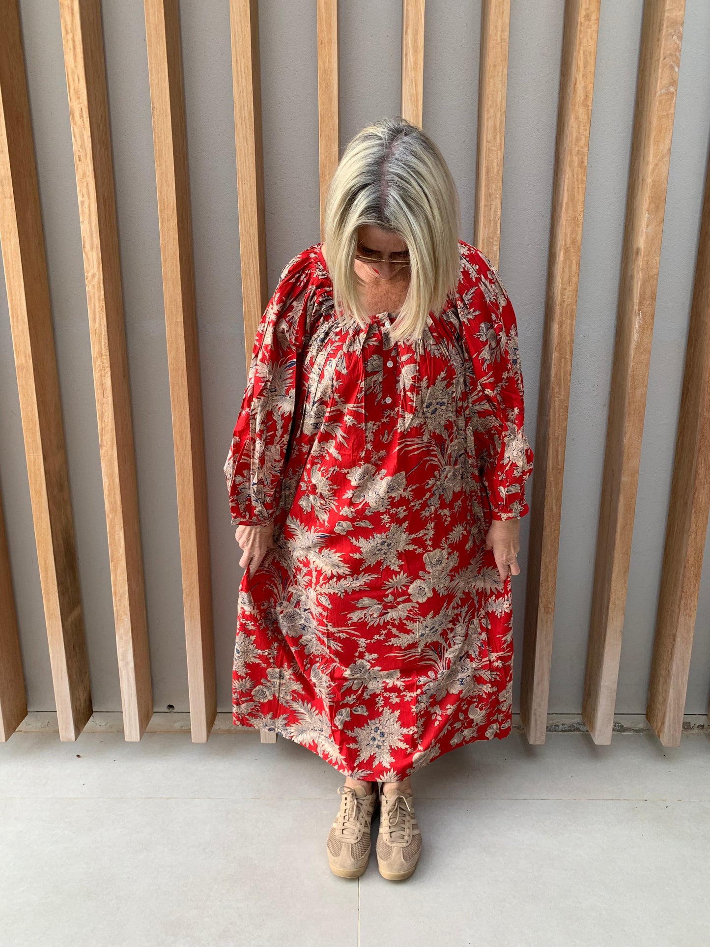 Red dress with beige floral pattern
