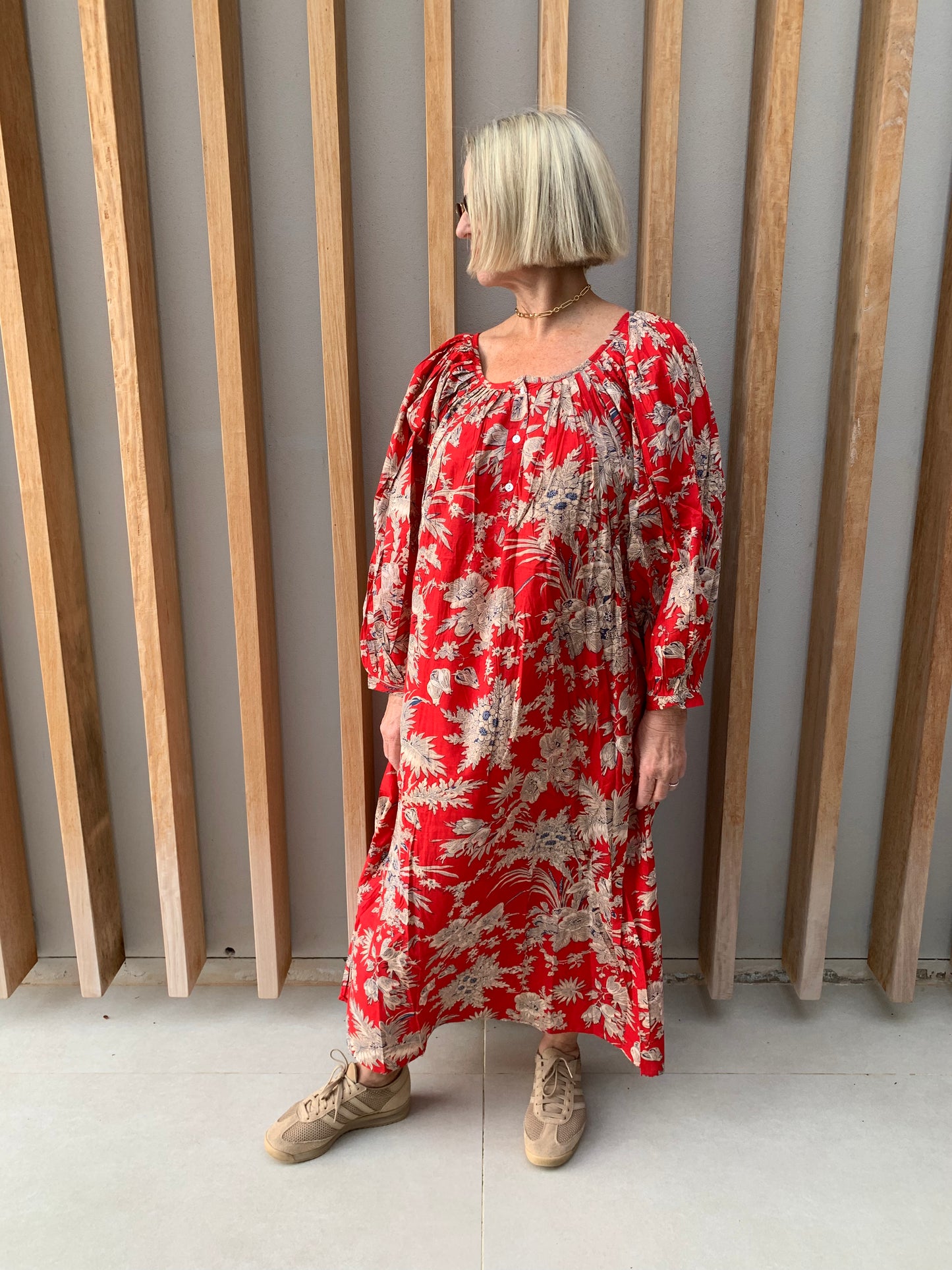 Red dress with beige floral pattern