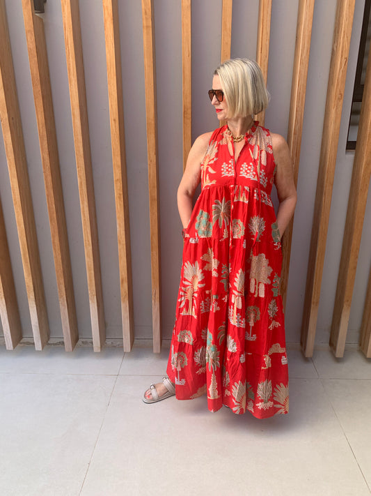 Red sleeveless dress with bronze fan palm pattern