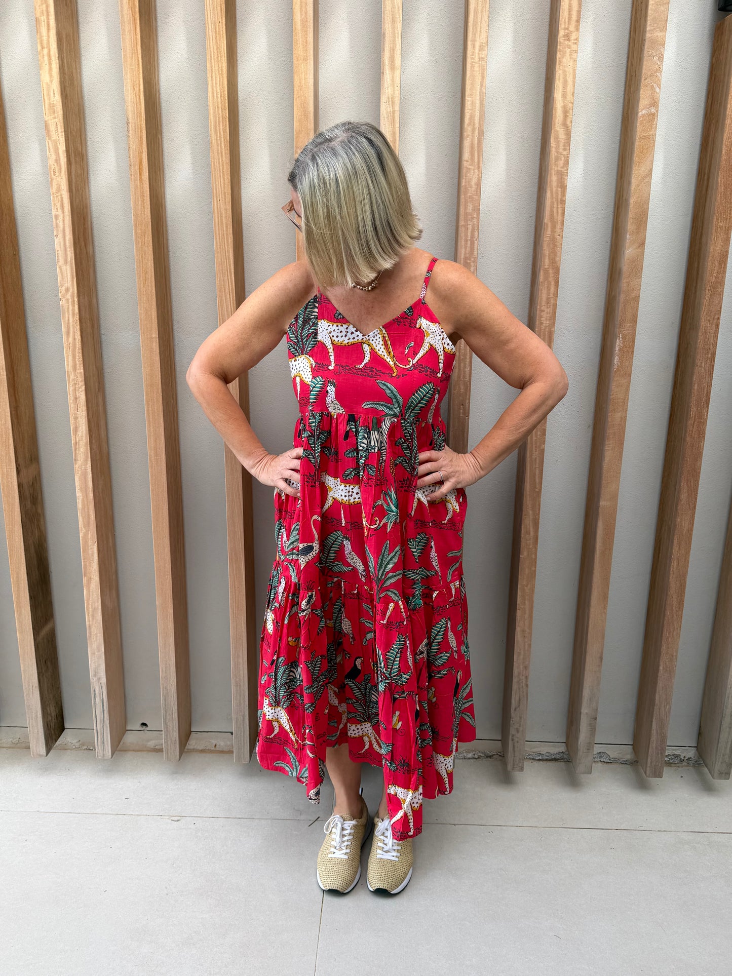 Red sleeveless dress with animal palm pattern