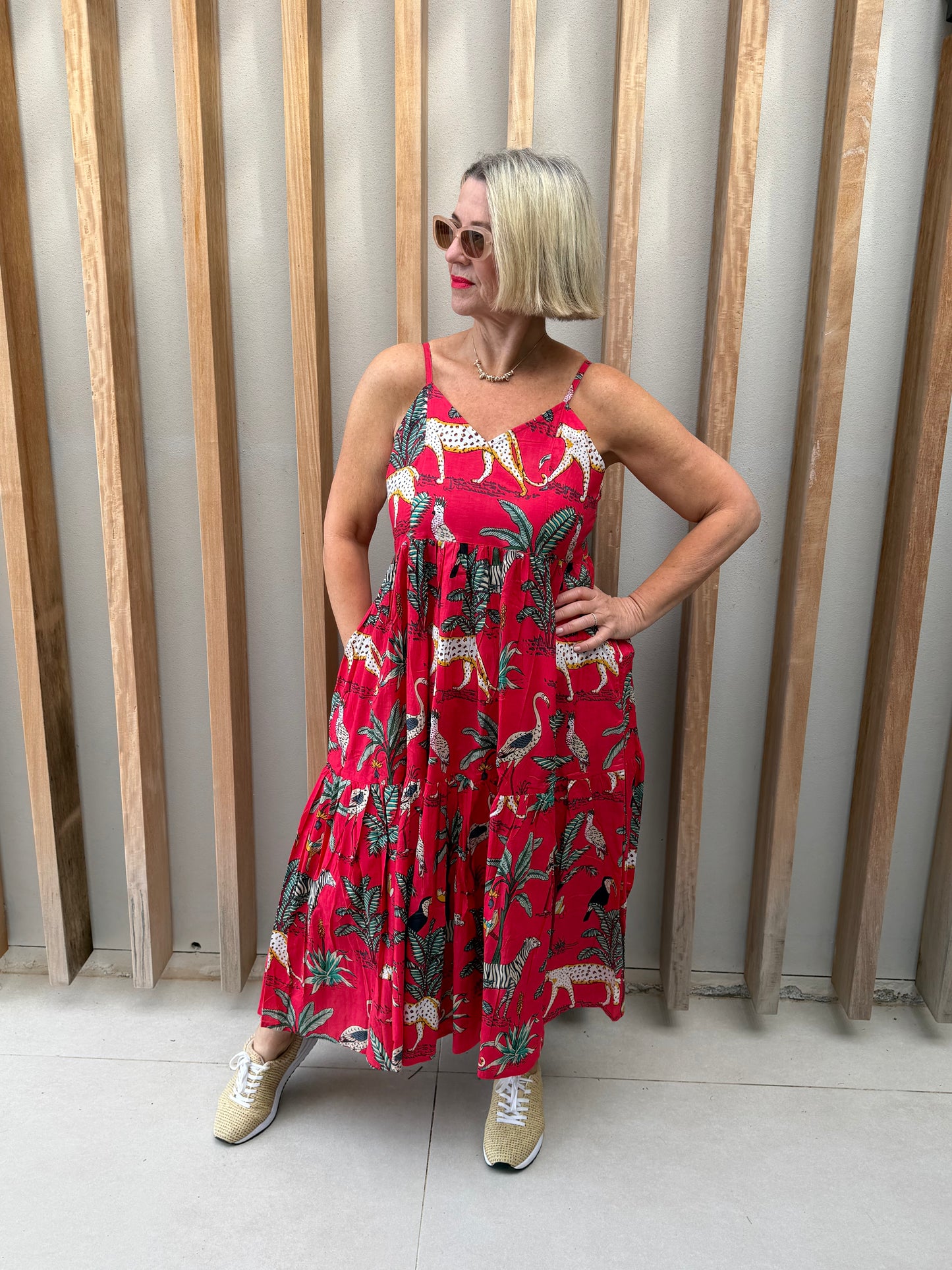 Red sleeveless dress with animal palm pattern