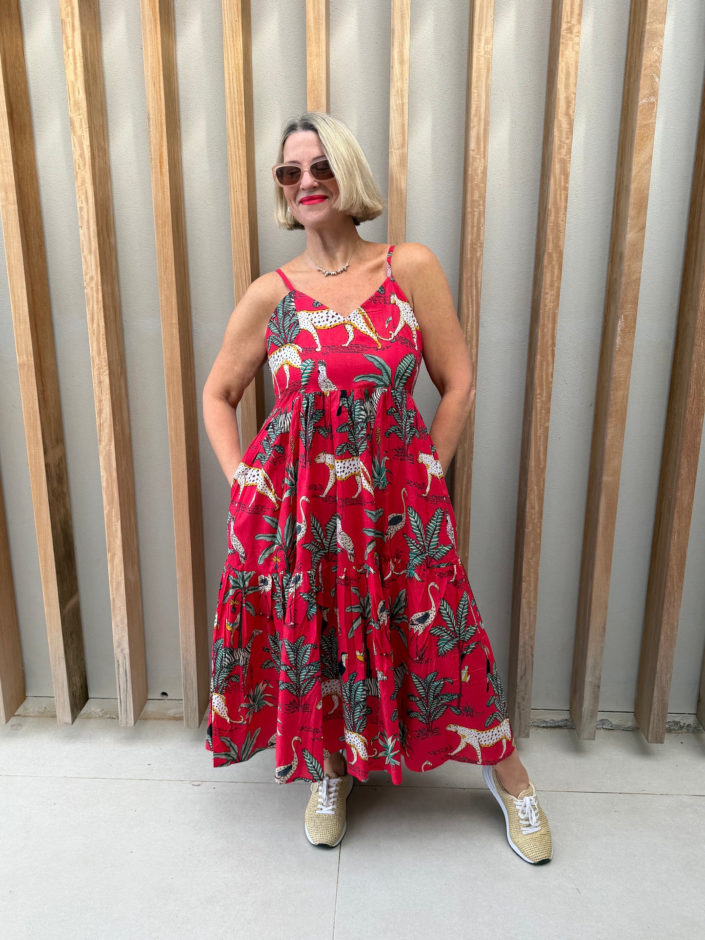 Red sleeveless dress with animal palm pattern