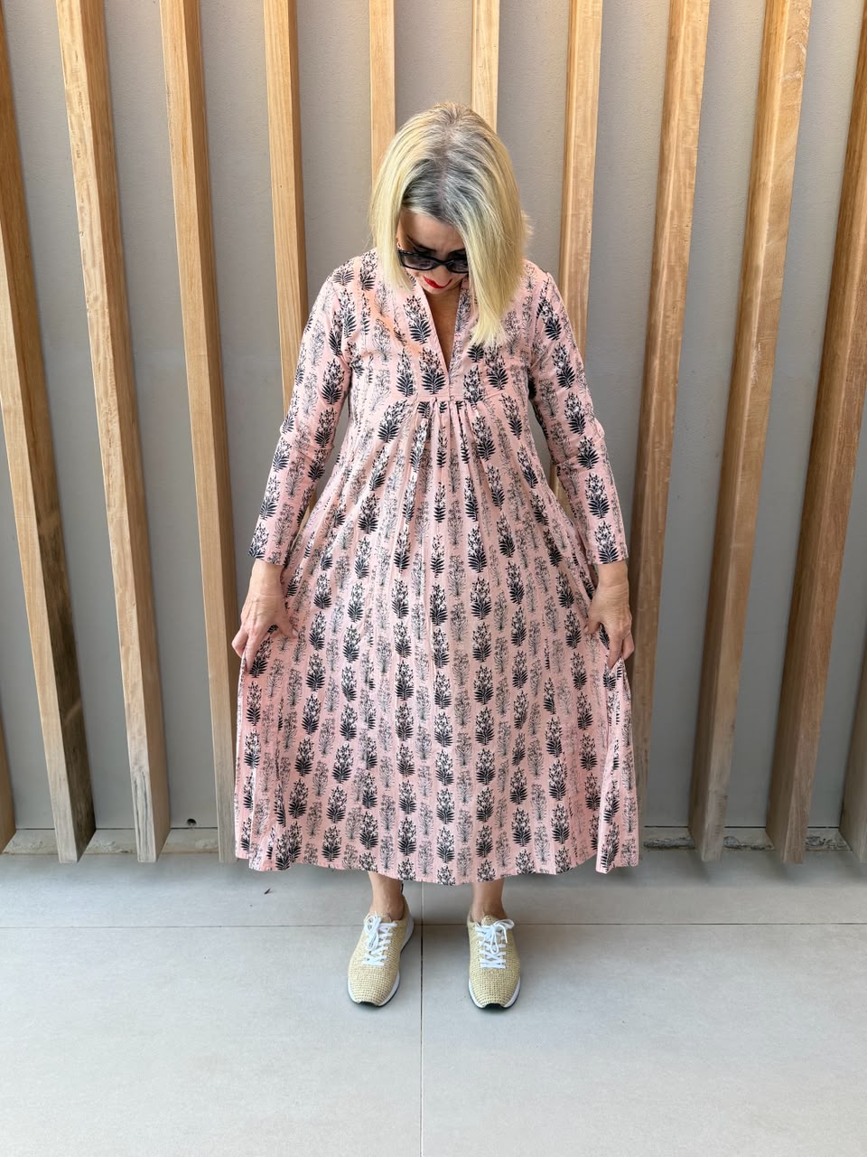 Salmon pink dress with black floral pattern