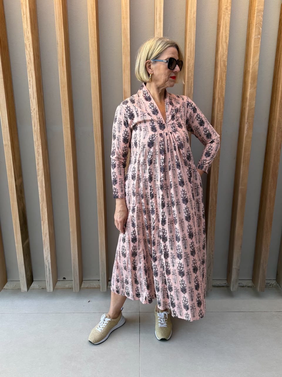 Salmon pink dress with black floral pattern