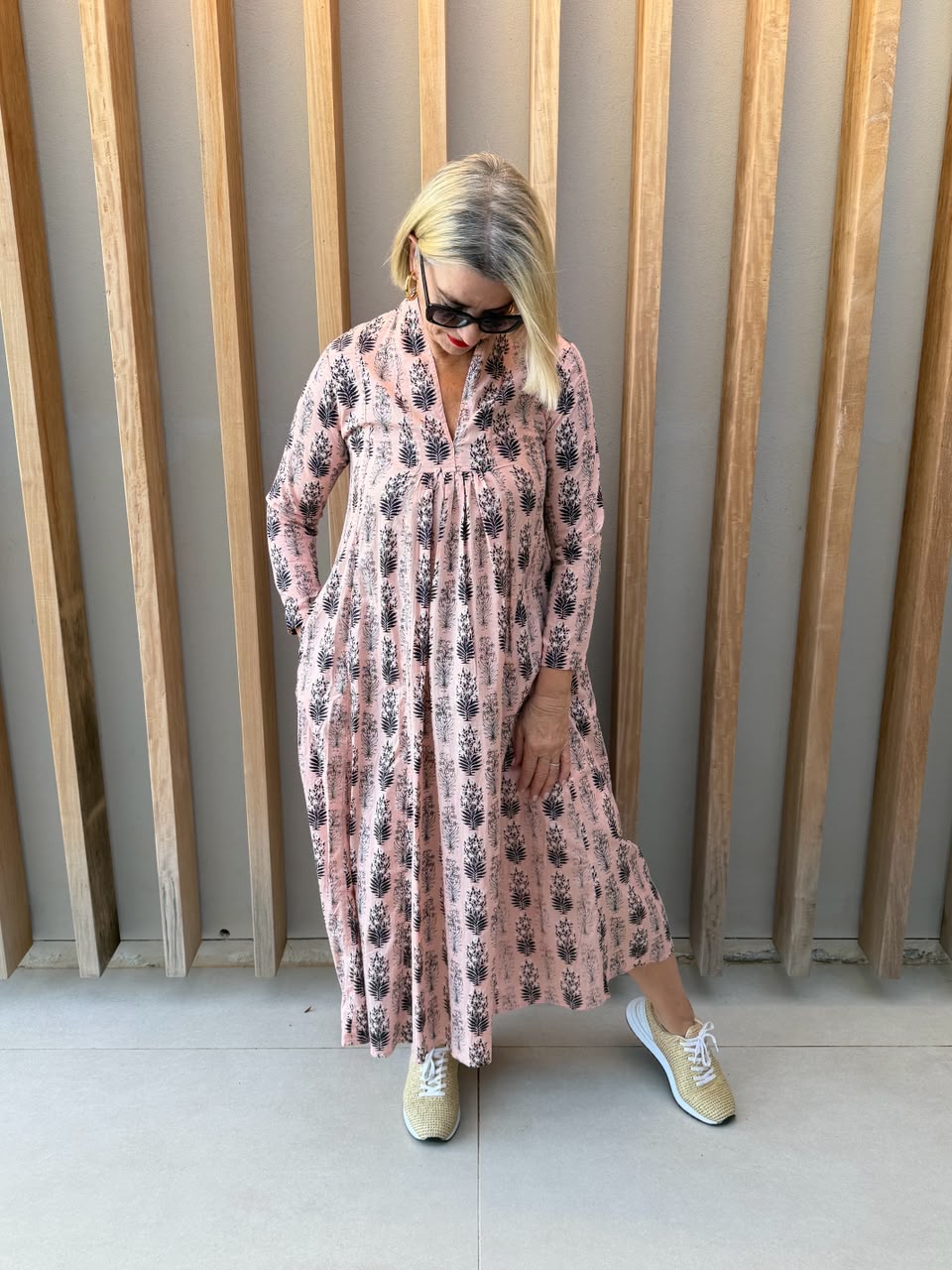 Salmon pink dress with black floral pattern