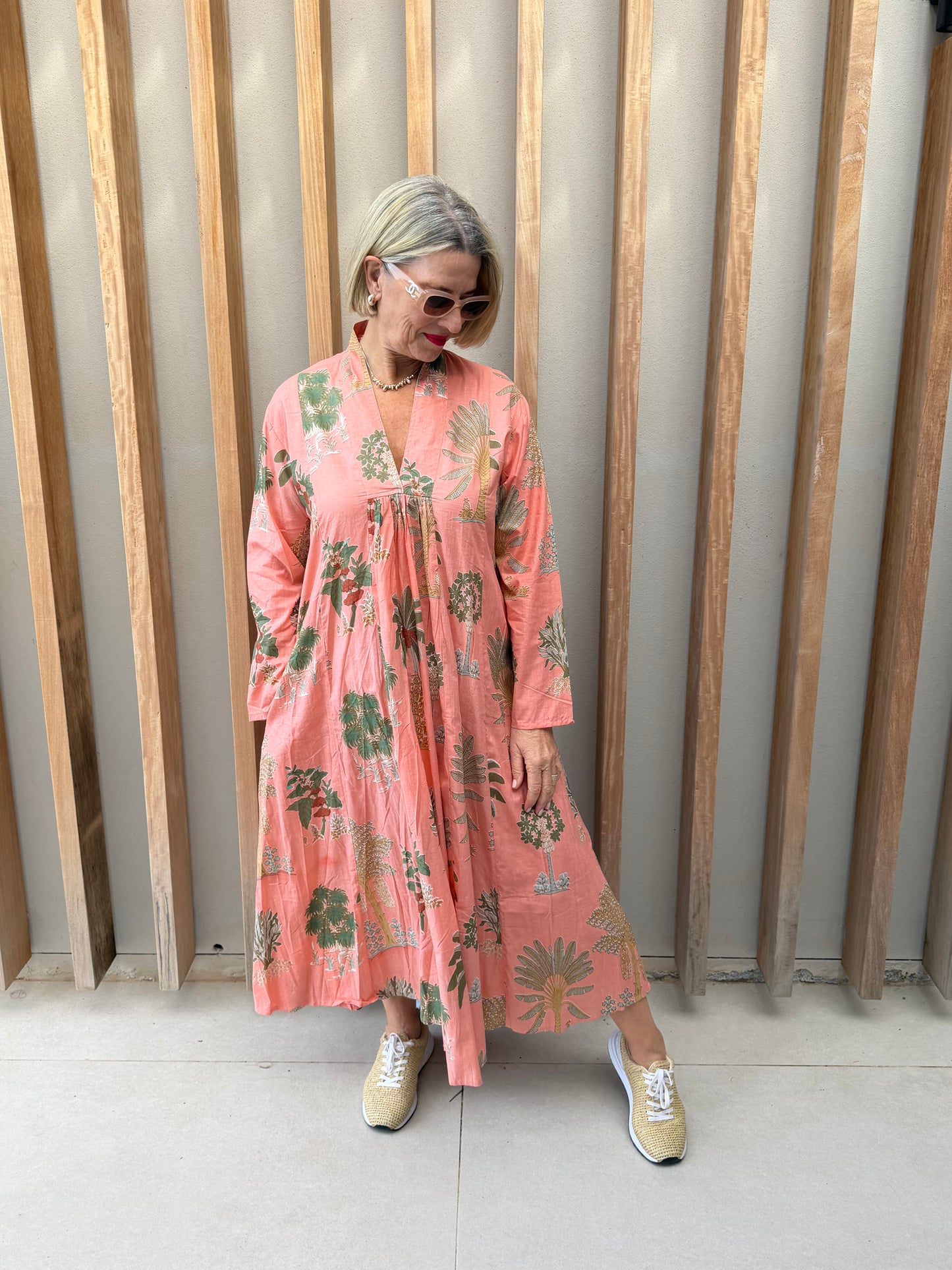 Salmon dress with floral palm pattern