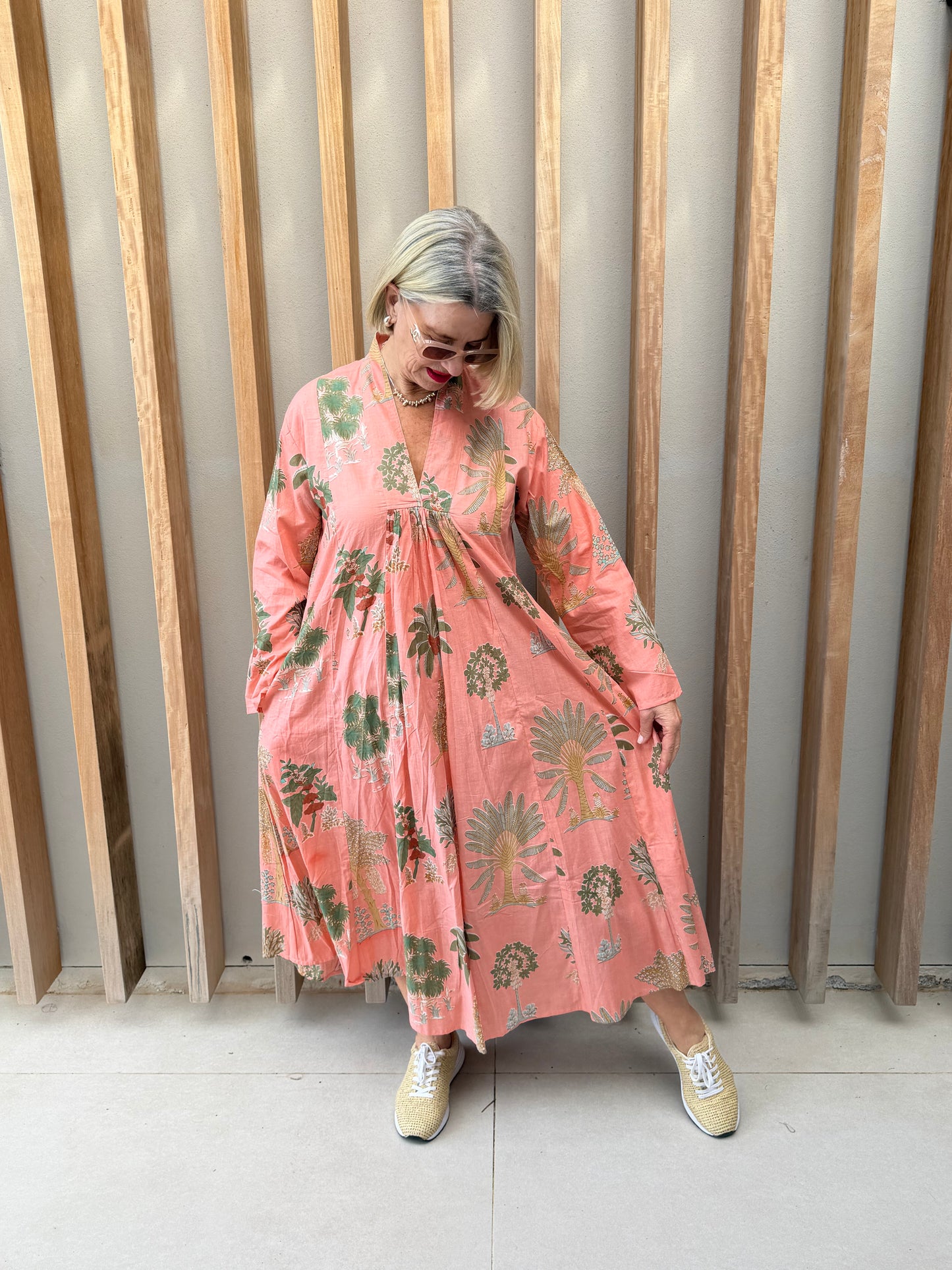 Salmon dress with floral palm pattern