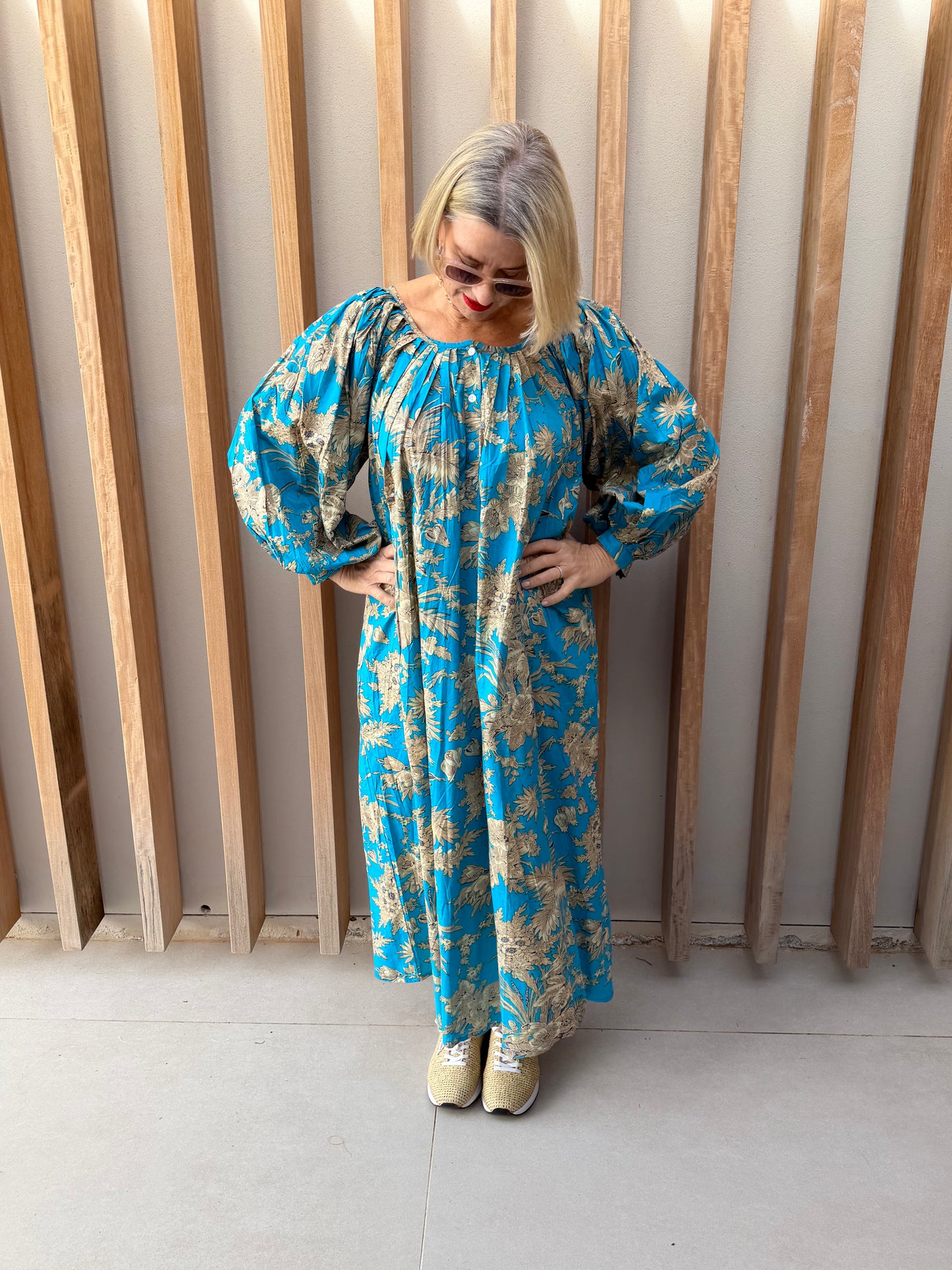 Turquoise dress with beige floral pattern
