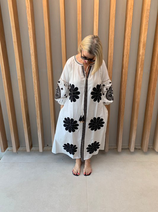 White dress with black geometric pattern