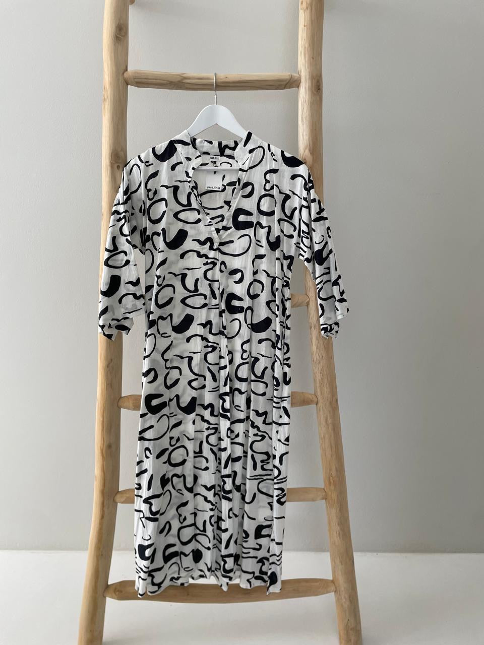 White dress with black pattern