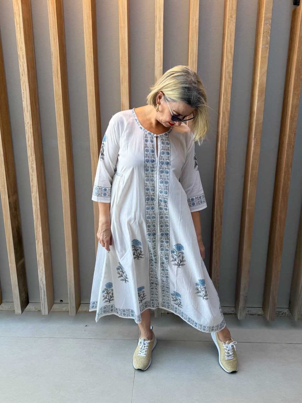 White dress with blue floral pattern